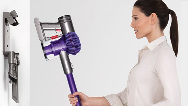 Model with Dyson wall-mounted dock